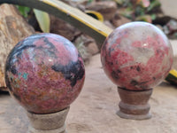 Polished Rhodonite Spheres x 2 From Zimbabwe - Toprock Gemstones and Minerals