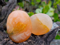 Polished Orange Twist Calcite Palm Stones x 24 From Madagascar - Toprock Gemstones and Minerals