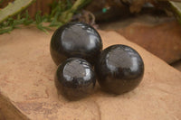 Polished Rare Iolite Spheres x 3 From Ambatofinandrahana, Madagascar - Toprock Gemstones and Minerals