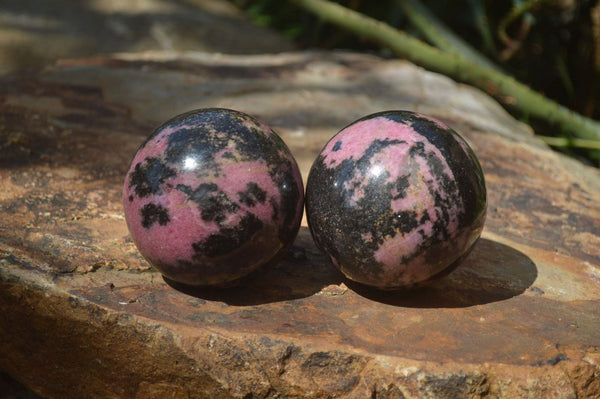 Polished Rhodonite Sphere x 2 From Ambindavato, Madagascar - Toprock Gemstones and Minerals 