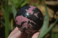 Polished Rhodonite Sphere x 2 From Ambindavato, Madagascar - Toprock Gemstones and Minerals 