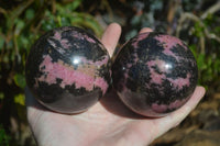 Polished Rhodonite Sphere x 2 From Ambindavato, Madagascar - Toprock Gemstones and Minerals 