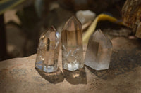 Polished Smokey Phantom Quartz Crystals x 12 From Madagascar - Toprock Gemstones and Minerals 
