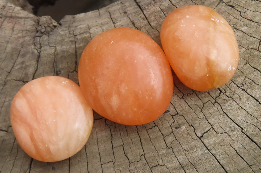 Polished Orange Twist Calcite Palm Stones x 20 From Madagascar - Toprock Gemstones and Minerals 