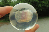 Polished Watermelon Fluorite cobbed piece in PVC Resin Paperweight Sphere - sold per item - From Namibia - Toprock Gemstones and Minerals 