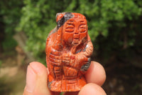 Polished Brecciated Jasper Far Eastern Carved Gods on Wooden Stands - sold per Set of 7 - From South Africa