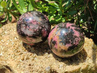 Polished Rhodonite Spheres x 2 From Ambindavato, Madagascar - Toprock Gemstones and Minerals 