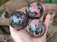 Polished Rhodonite Spheres x 4 From Rhusinga, Zimbabwe