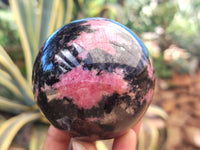 Polished Rhodonite Sphere x 3 From Ambindavato, Madagascar