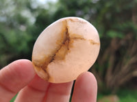 Polished Orange Twist Calcite Palm Stones x 24 From Maevantanana, Madagascar