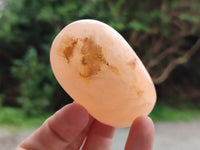 Polished Orange Twist Calcite Palm Stones x 24 From Maevantanana, Madagascar