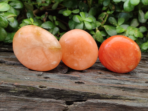 Polished Orange Twist Calcite Palm Stones x 24 From Maevantanana, Madagascar