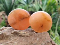 Polished Orange Twist Calcite Palm Stones x 24 From Maevantanana, Madagascar