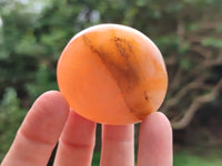 Polished Orange Twist Calcite Palm Stones x 24 From Maevantanana, Madagascar