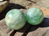 Polished Fluorescent Green Fluorite Spheres x 4 From Madagascar