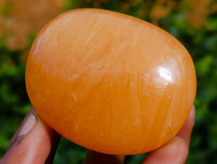 Polished Orange Twist Calcite Palm Stones x 25 From Maevantanana, Madagascar