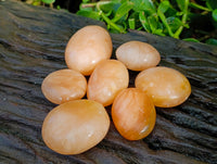 Polished Orange Twist Calcite Palm Stones x 25 From Maevantanana, Madagascar