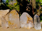 Polished Mix of Clear and Smokey Quartz Crystals with Golden Rutile Inclusion x 4 From Ambatondrazaka, Madagascar - Toprock Gemstones and Minerals 