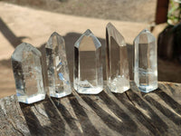 Polished Clear and Smokey Phantom Quartz Crystals with Rainbow Veils x 24 From Madagascar - Toprock Gemstones and Minerals 