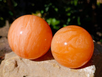 Polished Orange Twist Calcite Spheres x 3 From Madagascar
