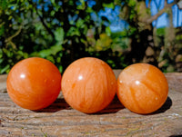 Polished Orange Twist Calcite Spheres x 3 From Madagascar