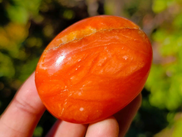 Polished Orange Twist Calcite Palm Stones x 28 From Madagascar