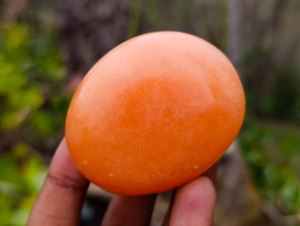 Polished Orange Twist Calcite Palm Stones x 24 From Madagascar