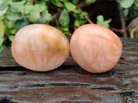 Polished Orange Twist Calcite Palm Stones x 24 From Maevantanana, Madagascar
