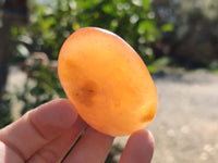 Polished Orange Twist Calcite Palm Stones x 24 From Maevantanana, Madagascar
