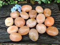 Polished Orange Twist Calcite Palm Stones x 24 From Maevantanana, Madagascar