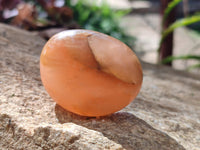 Polished Orange Twist Calcite Palm Stones x 24 From Maevantanana, Madagascar