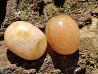 Polished Orange Twist Calcite Palm Stones x 24 From Maevantanana, Madagascar