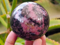 Polished Rhodonite Spheres x 4 From Ambindavato, Madagascar - Toprock Gemstones and Minerals 