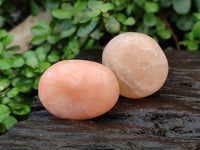 Polished Orange Twist Calcite Palm Stones x 20 From Maevantanana, Madagascar