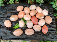 Polished Orange Twist Calcite Palm Stones x 20 From Maevantanana, Madagascar