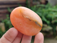 Polished Orange Twist Calcite Palm Stones x 20 From Maevantanana, Madagascar