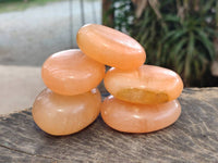 Polished Orange Twist Calcite Galets x 12 From Maevantanana, Madagascar
