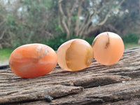 Polished Orange Twist Calcite Galets x 12 From Maevantanana, Madagascar