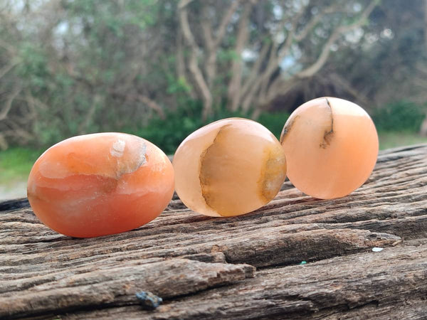 Polished Orange Twist Calcite Galets x 12 From Maevantanana, Madagascar