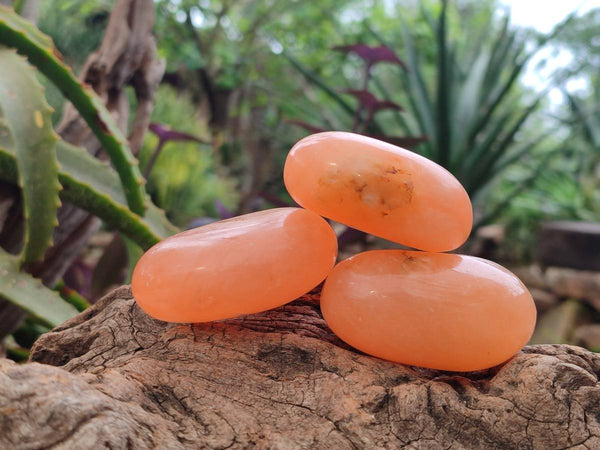 Polished Orange Twist Calcite Galets x 12 From Maevantanana, Madagascar