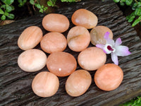 Polished Orange Twist Calcite Galets x 12 From Maevantanana, Madagascar