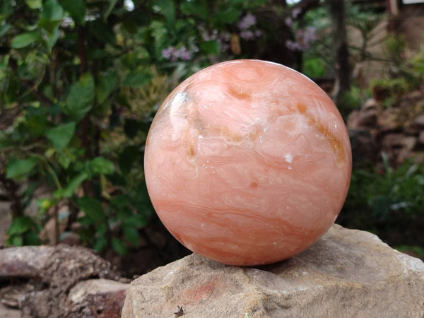 Polished Orange Twist Calcite Sphere x 1 From Maevantanana, Madagascar