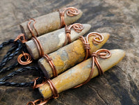 Natural Belemnite Fossil Bullet Copper Art Pendant With Plaited Cord - sold per piece - From Madagascar