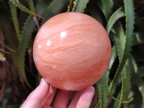 Polished Orange Twist Calcite Sphere x 1 From Maevantanana, Madagascar