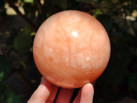 Polished Orange Twist Calcite Sphere x 1 From Maevantanana, Madagascar