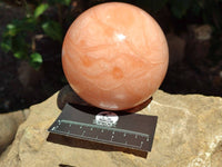 Polished Orange Twist Calcite Sphere x 1 From Maevantanana, Madagascar