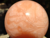 Polished Orange Twist Calcite Sphere x 1 From Maevantanana, Madagascar