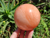 Polished Orange Twist Calcite Sphere x 1 From Maevantanana, Madagascar