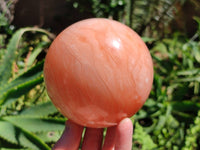 Polished Orange Twist Calcite Sphere x 1 From Maevantanana, Madagascar
