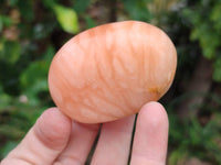 Polished Orange Twist Calcite Galets x 20 From Maevantanana, Madagascar
